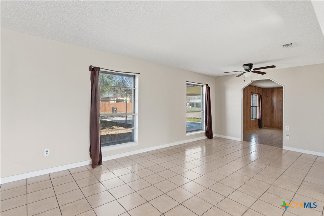 102 Runnel Street Seguin, TX 78155 - Photo 6 of 34 a view of an empty room with window and wooden floor