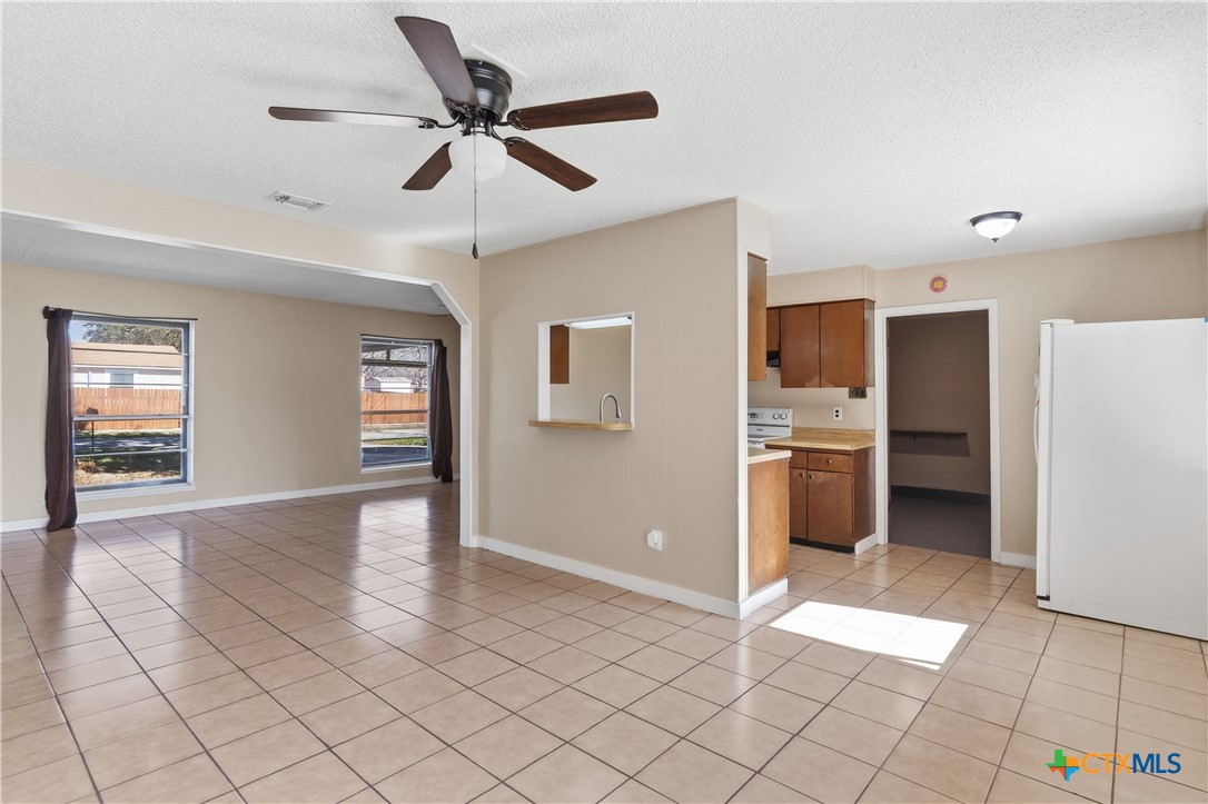 102 Runnel Street Seguin, TX 78155 - Photo 10 of 34 a view of a kitchen with a sink and a refrigerator