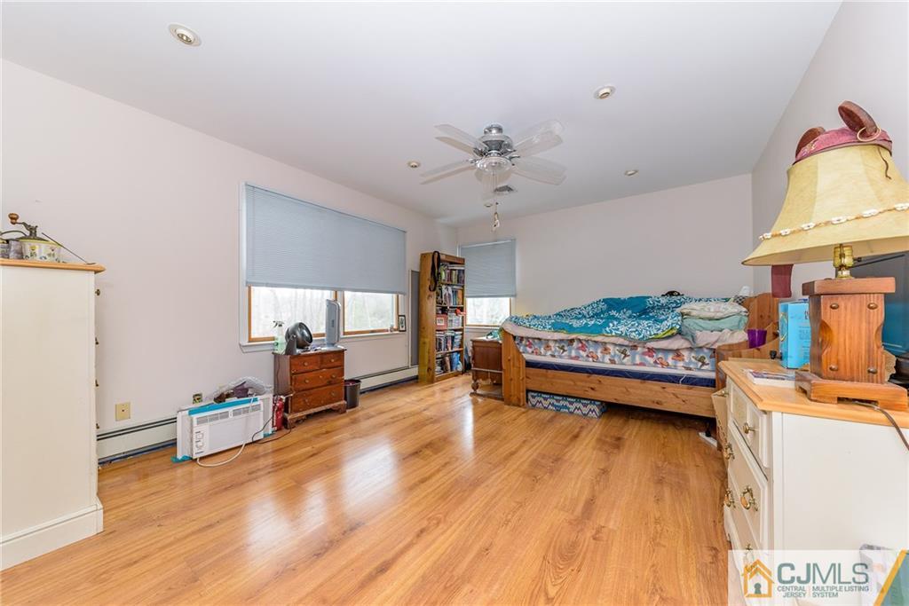 88 Emmans Road Ledgewood, NJ 07852 - Photo 11 of 25 a view of game room with window and wooden floor