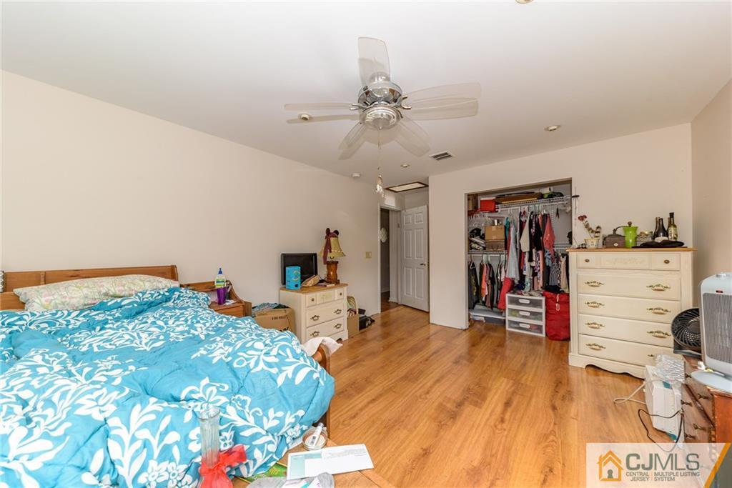 88 Emmans Road Ledgewood, NJ 07852 - Photo 12 of 25 a bed room with a bed and a tv
