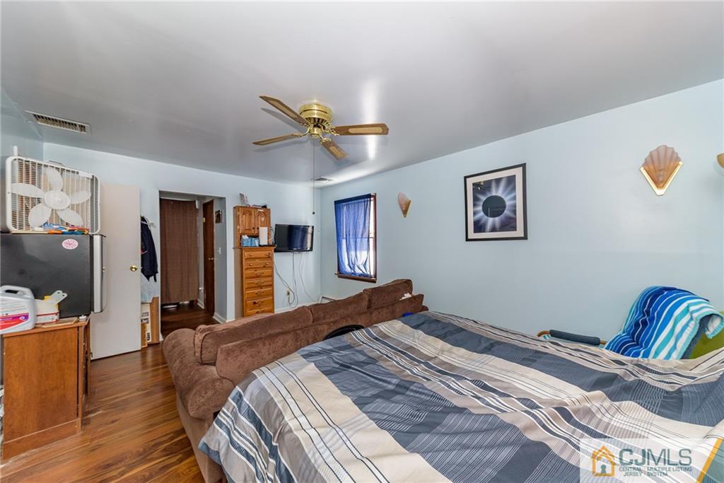 88 Emmans Road Ledgewood, NJ 07852 - Photo 16 of 25 a bedroom with bed and a chandelier