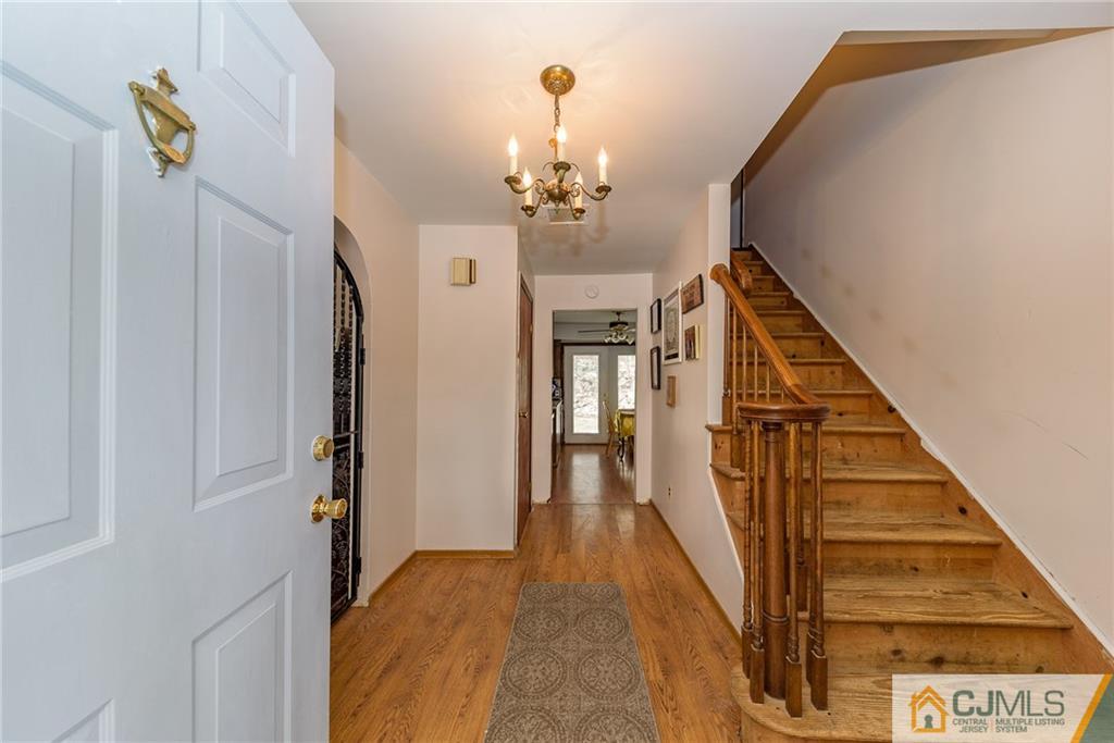 88 Emmans Road Ledgewood, NJ 07852 - Photo 3 of 25 a view of a hallway with wooden floor and staircase