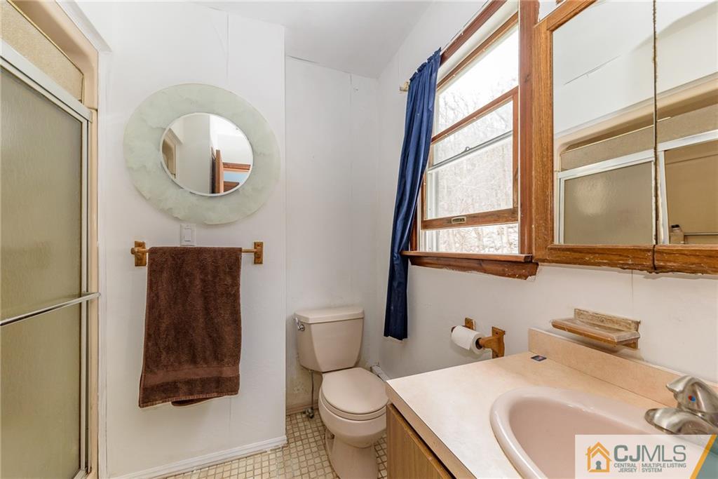 88 Emmans Road Ledgewood, NJ 07852 - Photo 21 of 25 a bathroom with a toilet sink and mirror