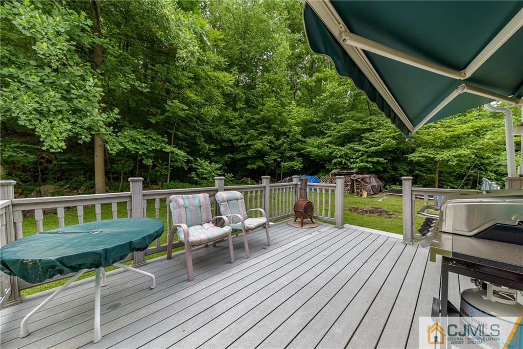 88 Emmans Road Ledgewood, NJ 07852 - Photo 23 of 25 a view of house with a deck and furniture