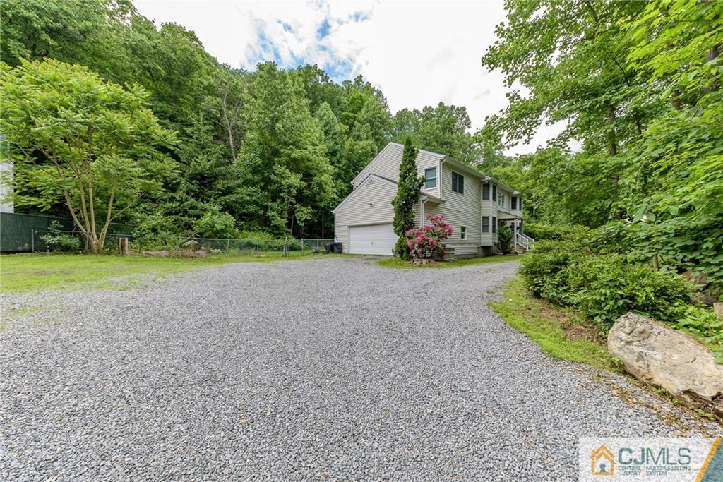 88 Emmans Road Ledgewood, NJ 07852 - Photo 24 of 25 a view of a house with a yard and large trees