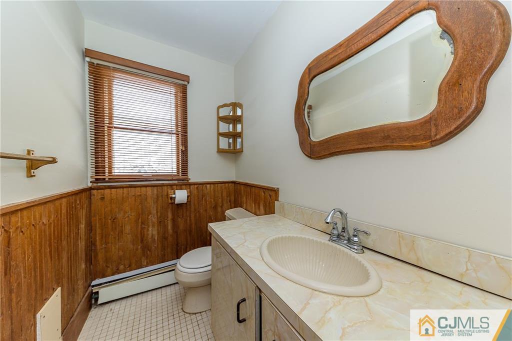 88 Emmans Road Ledgewood, NJ 07852 - Photo 8 of 25 a bathroom with a sink a toilet and a mirror