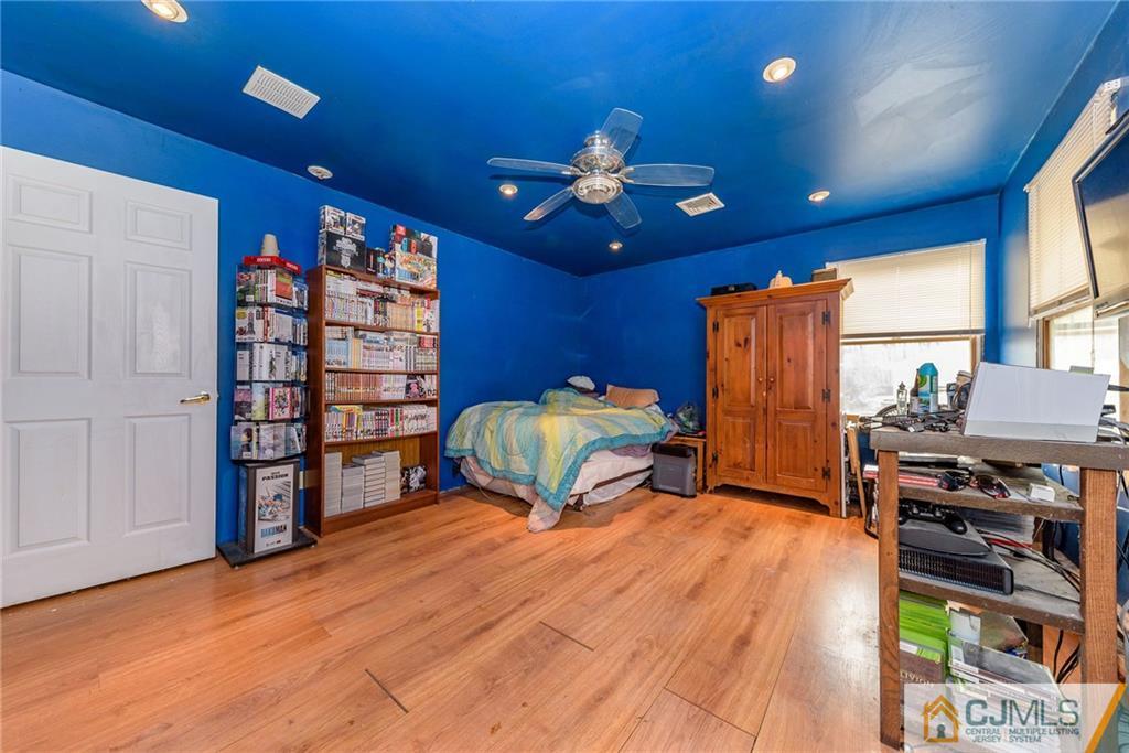 88 Emmans Road Ledgewood, NJ 07852 - Photo 10 of 25 a bedroom with furniture and a chandelier