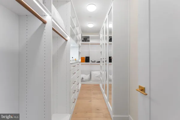 a bedroom with a bed and a lamp