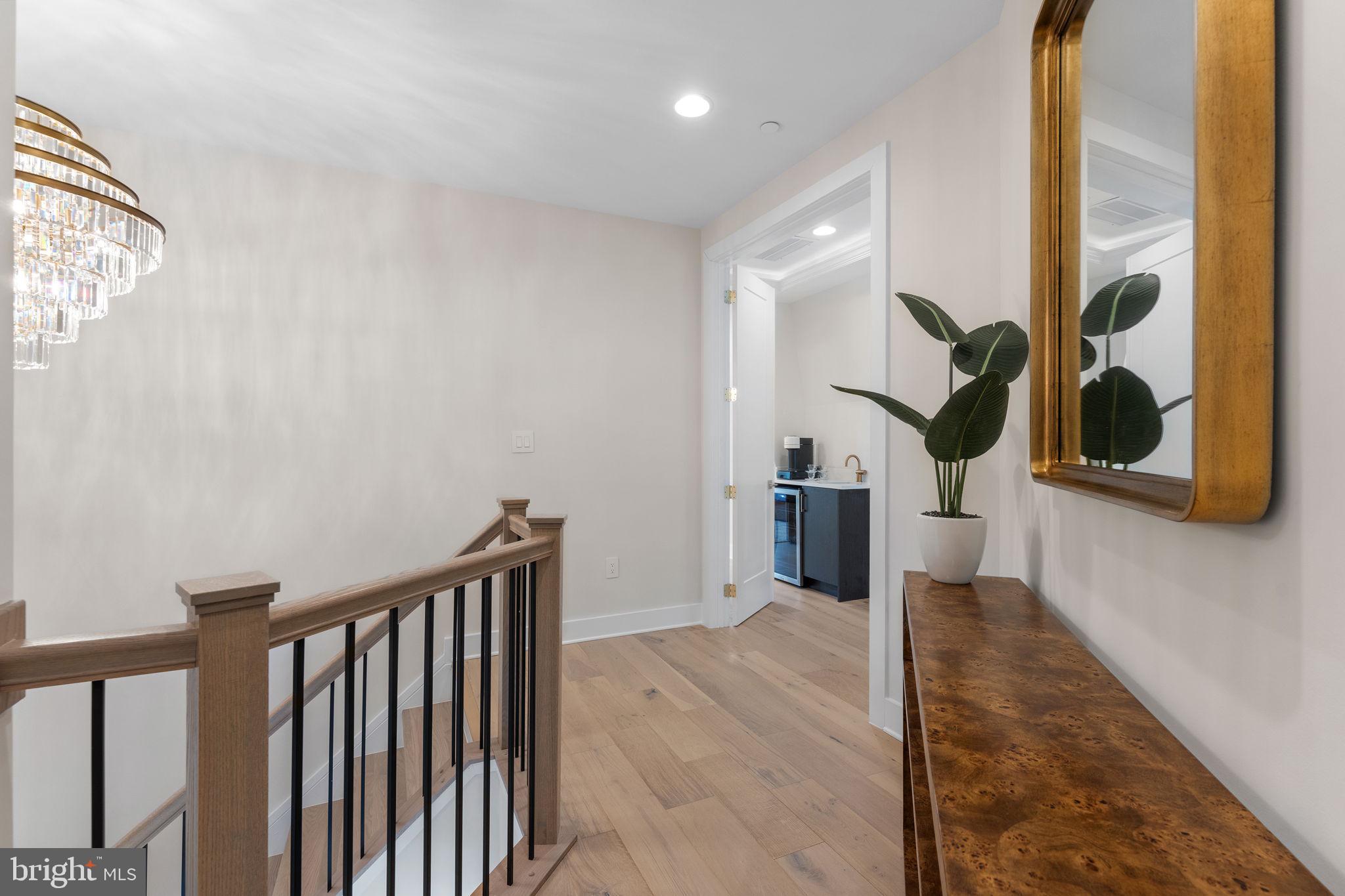 1620 Chain Bridge Road McLean, VA 22101 - Photo 29 of 68 a view of a hallway with wooden floor and staircase