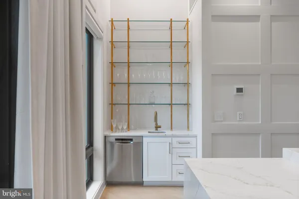 a view of a living room and a balcony