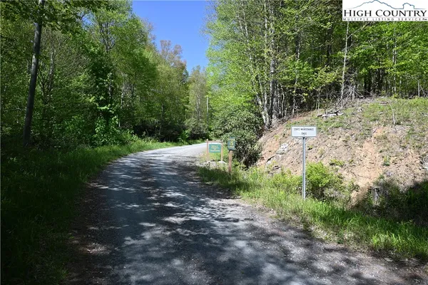 a big yard with flowing stream of water in middle