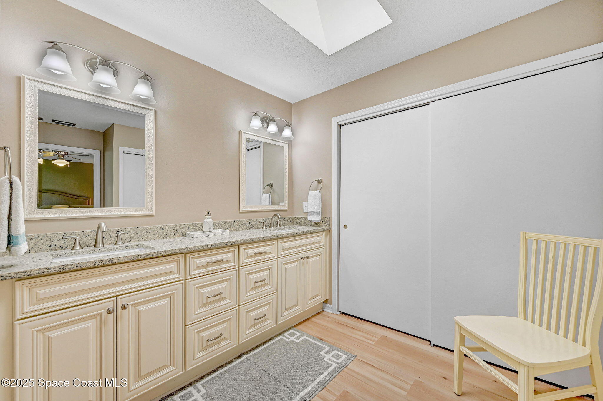 730 Spring Valley Drive Melbourne, FL 32940 - Photo 14 of 39 a bathroom with a granite countertop sink mirror and a