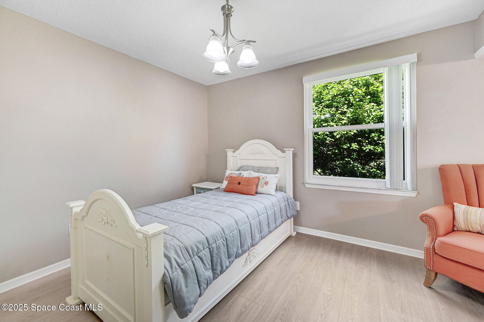 730 Spring Valley Drive Melbourne, FL 32940 - Photo 33 of 39 a bedroom with a bed and a window