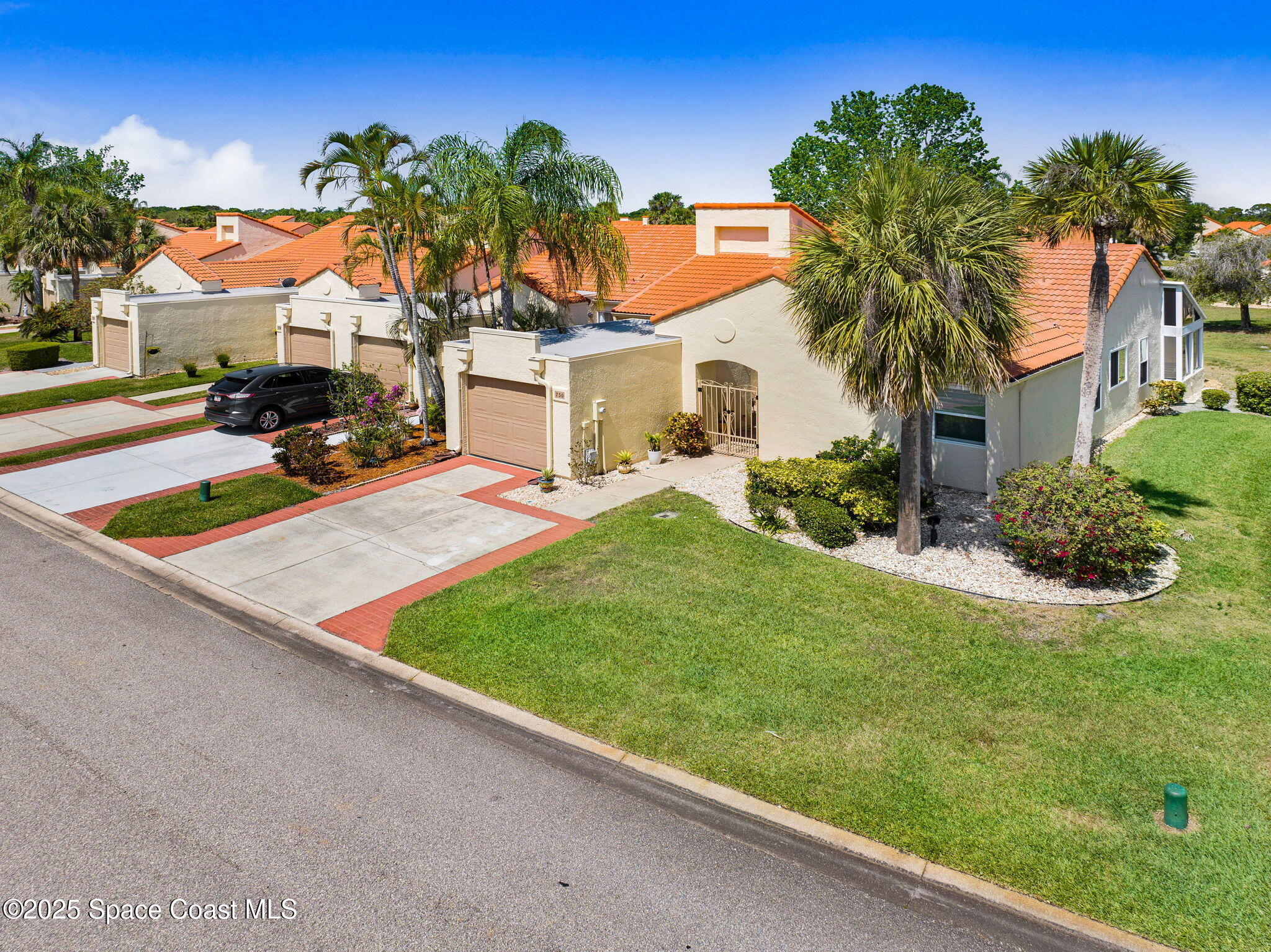 730 Spring Valley Drive Melbourne, FL 32940 - Photo 36 of 39 a front view of a house with garden