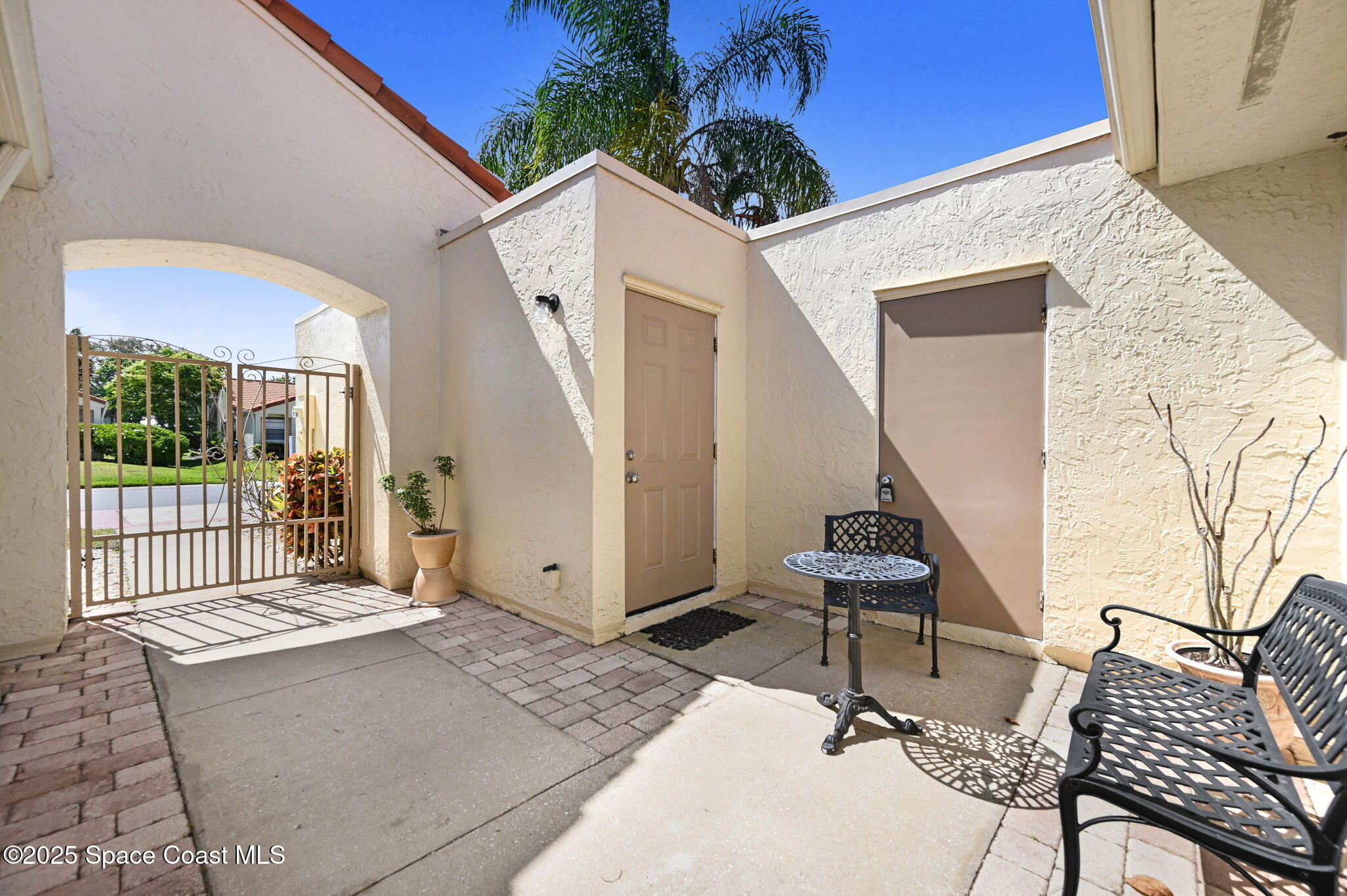 730 Spring Valley Drive Melbourne, FL 32940 - Photo 9 of 39 a view of a patio with a table and chairs