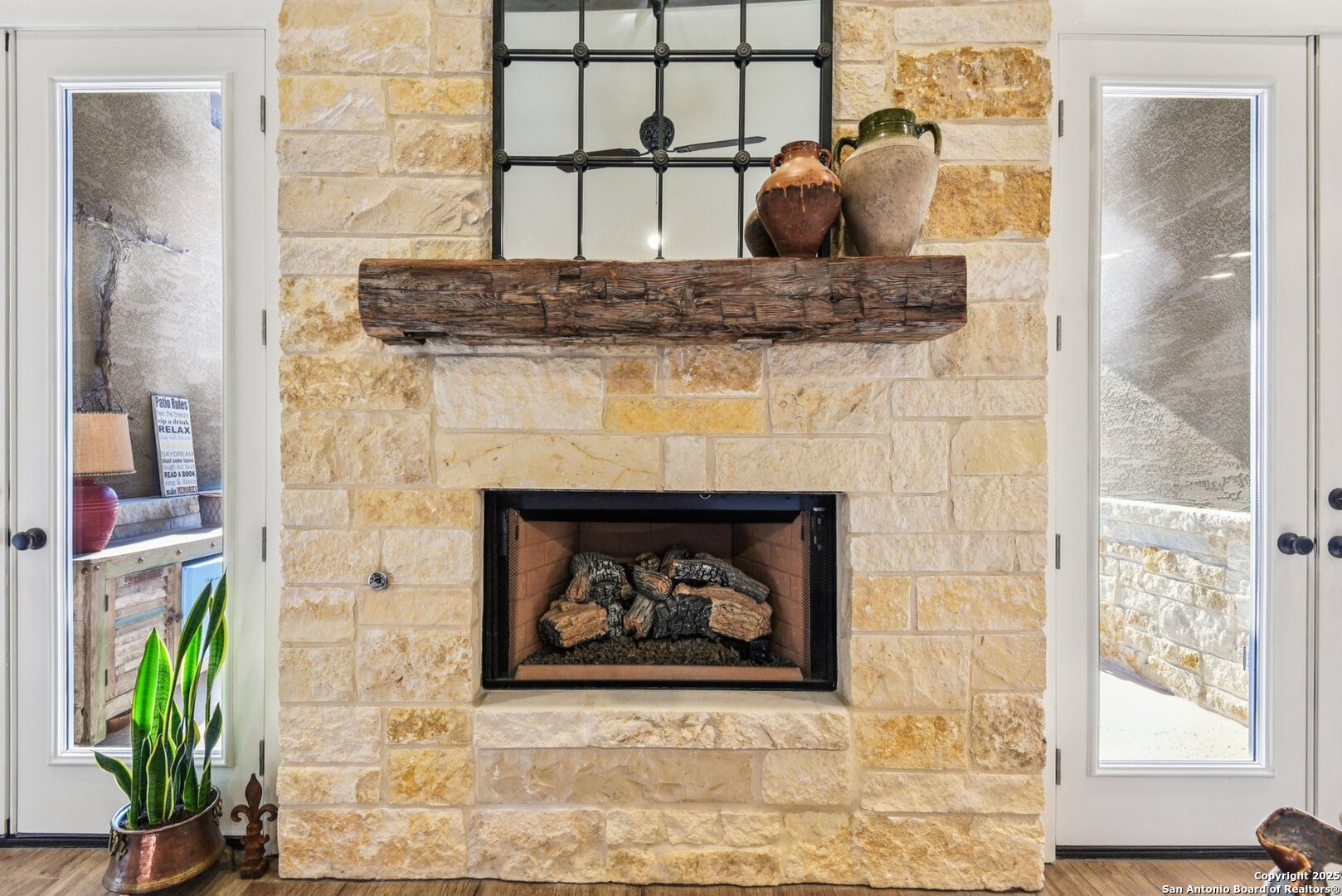 449 Hanging Oak Spring Branch, TX 78070 - Photo 11 of 49 a living room with a fireplace and a painting on the wall