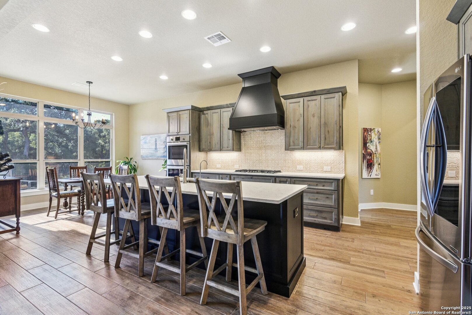 449 Hanging Oak Spring Branch, TX 78070 - Photo 15 of 49 a large kitchen with a table and chairs