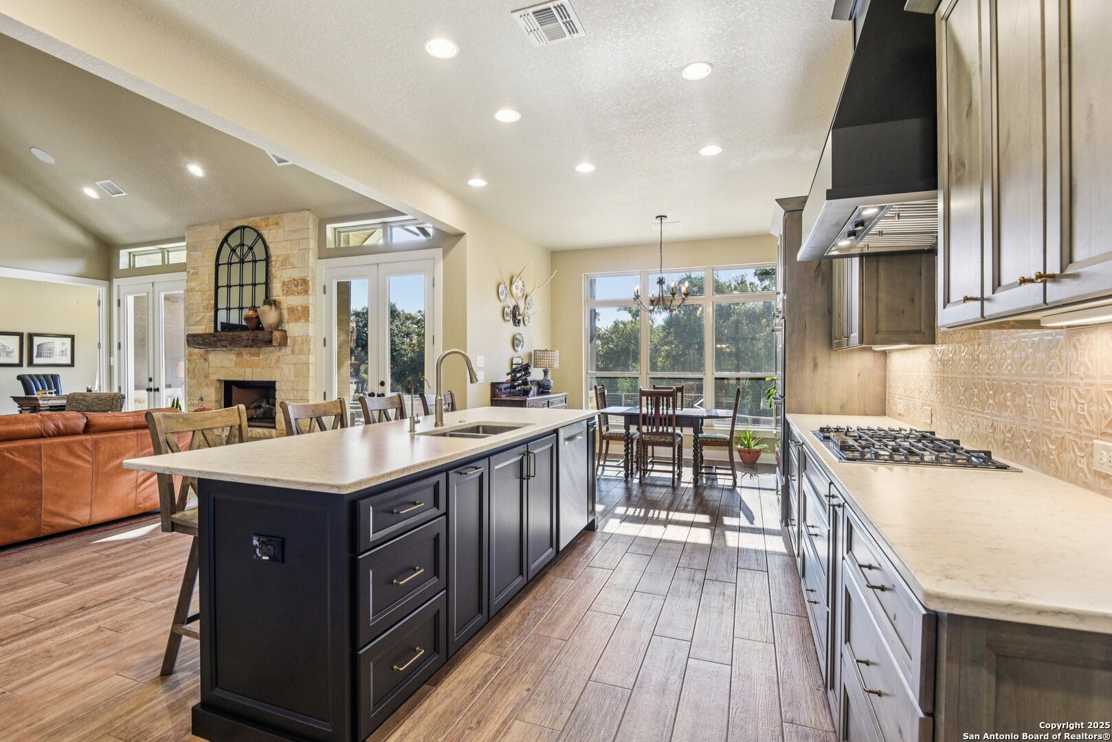 449 Hanging Oak Spring Branch, TX 78070 - Photo 17 of 49 a kitchen with stainless steel appliances granite countertop a stove and a sink