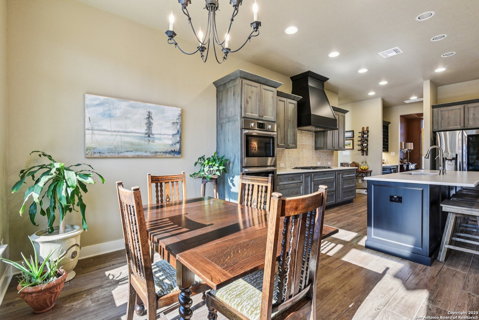 449 Hanging Oak Spring Branch, TX 78070 - Photo 19 of 49 a view of a dining room with furniture a kitchen and chandelier