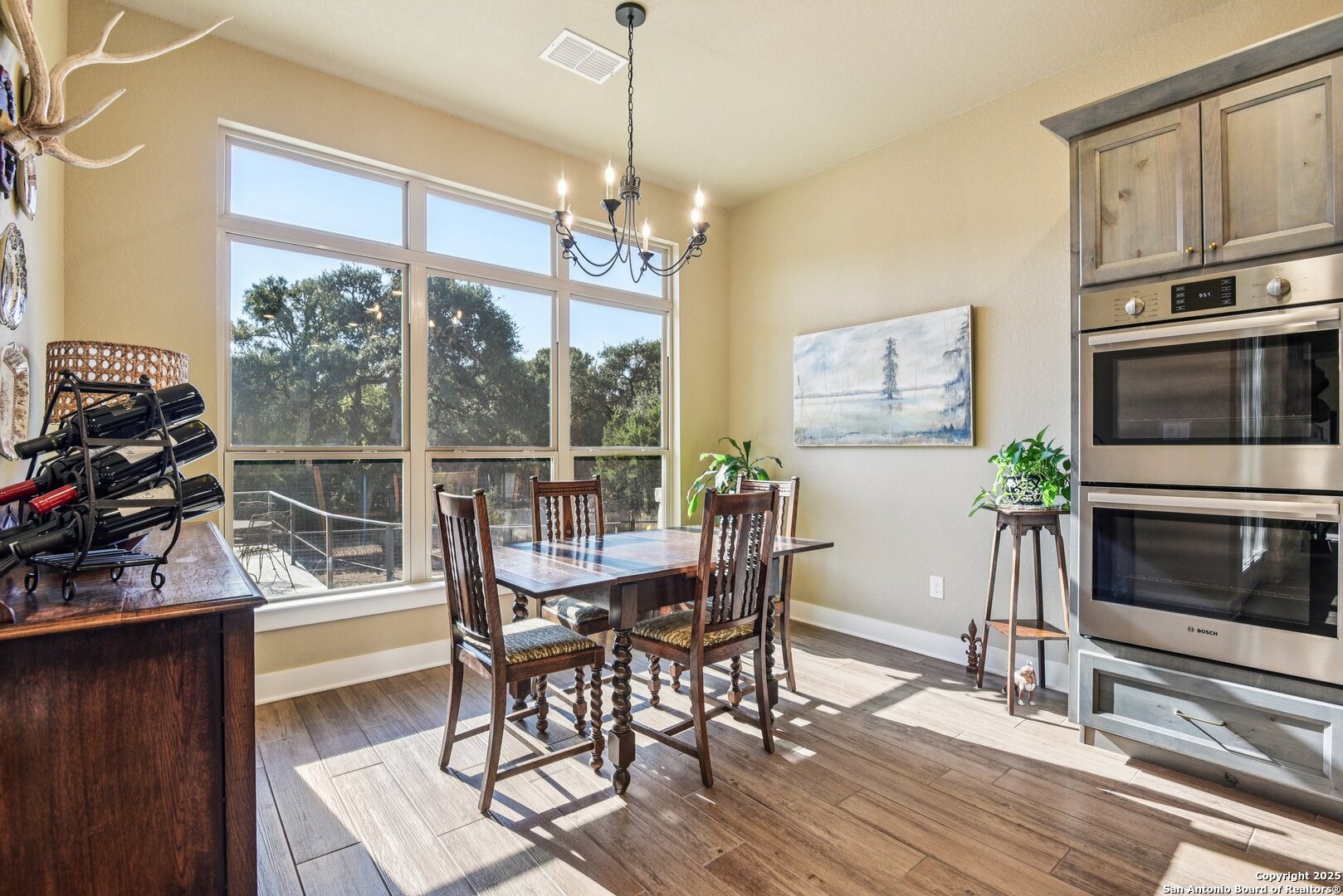 449 Hanging Oak Spring Branch, TX 78070 - Photo 20 of 49 a view of a dining room with furniture window and wooden floor