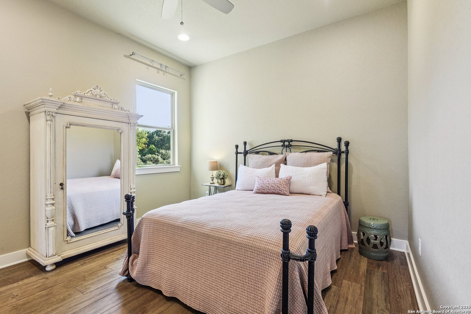 449 Hanging Oak Spring Branch, TX 78070 - Photo 26 of 49 a bedroom with a bed and wooden floor