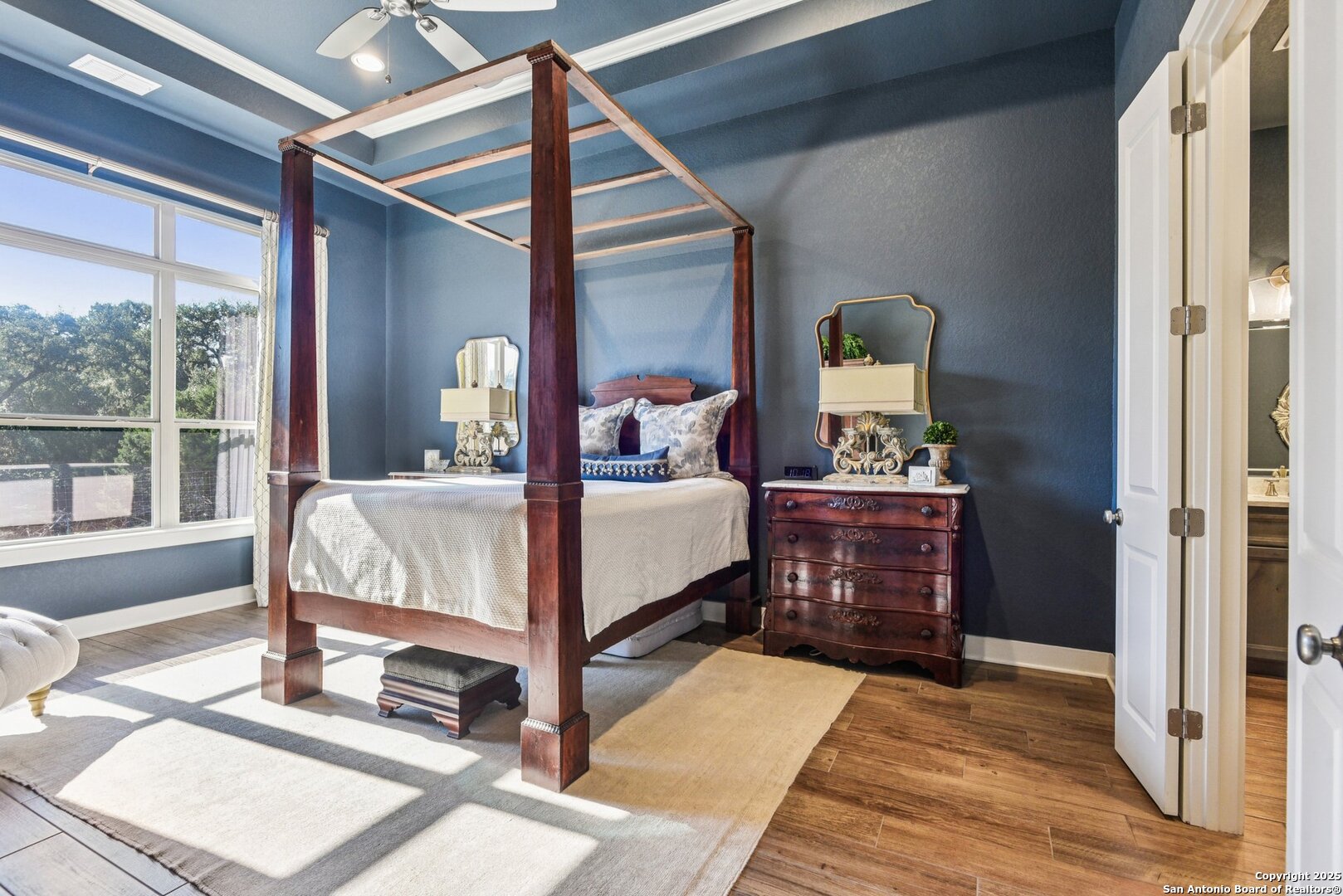 449 Hanging Oak Spring Branch, TX 78070 - Photo 35 of 49 a bedroom with a bed lamp closet and large window