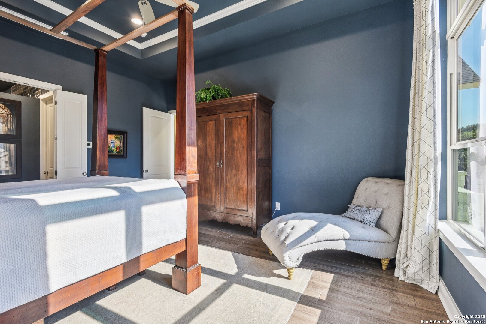 449 Hanging Oak Spring Branch, TX 78070 - Photo 36 of 49 a bedroom with a bed and wooden floor