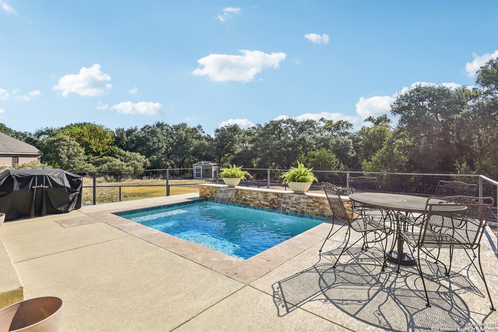 449 Hanging Oak Spring Branch, TX 78070 - Photo 44 of 49 a view of a swimming pool with a patio and a garden