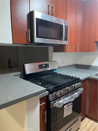 a kitchen with a stove and a microwave