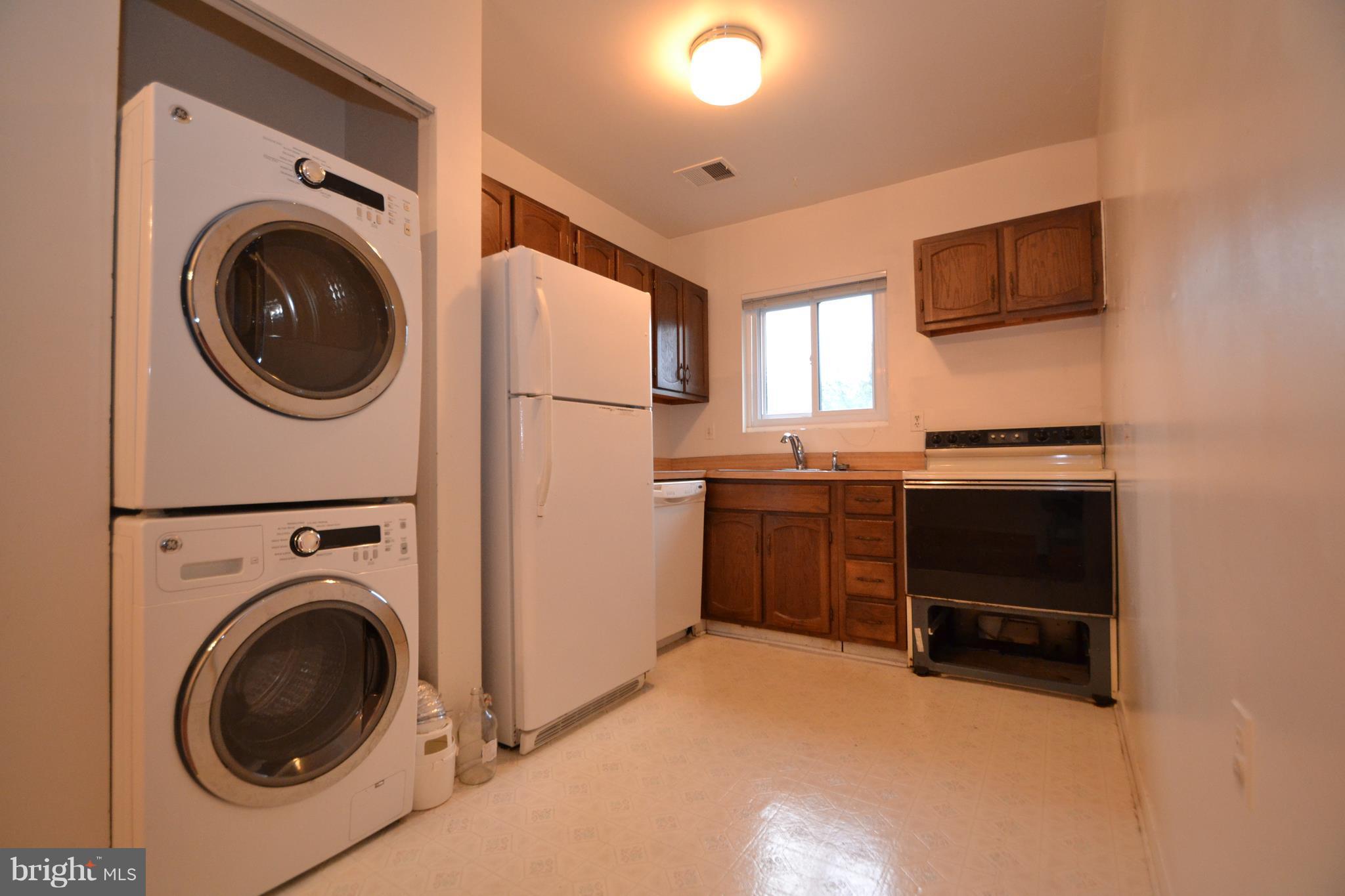 3922 Rolling Rd., Unit A5 Baltimore, MD 21208 - Photo 4 of 8 a view of a kitchen with washer and dryer