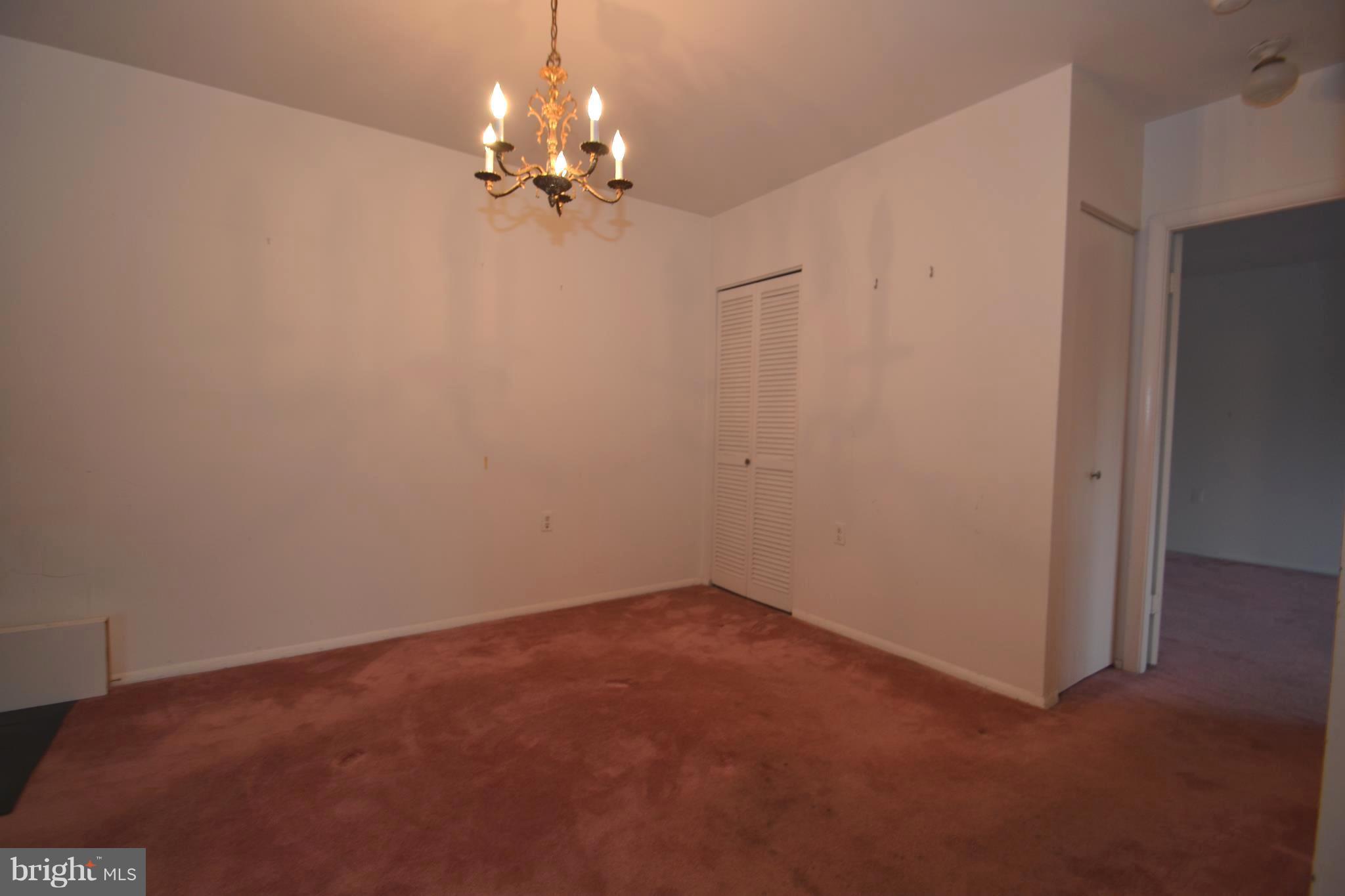 3922 Rolling Rd., Unit A5 Baltimore, MD 21208 - Photo 5 of 8 a view of a chandelier in big room
