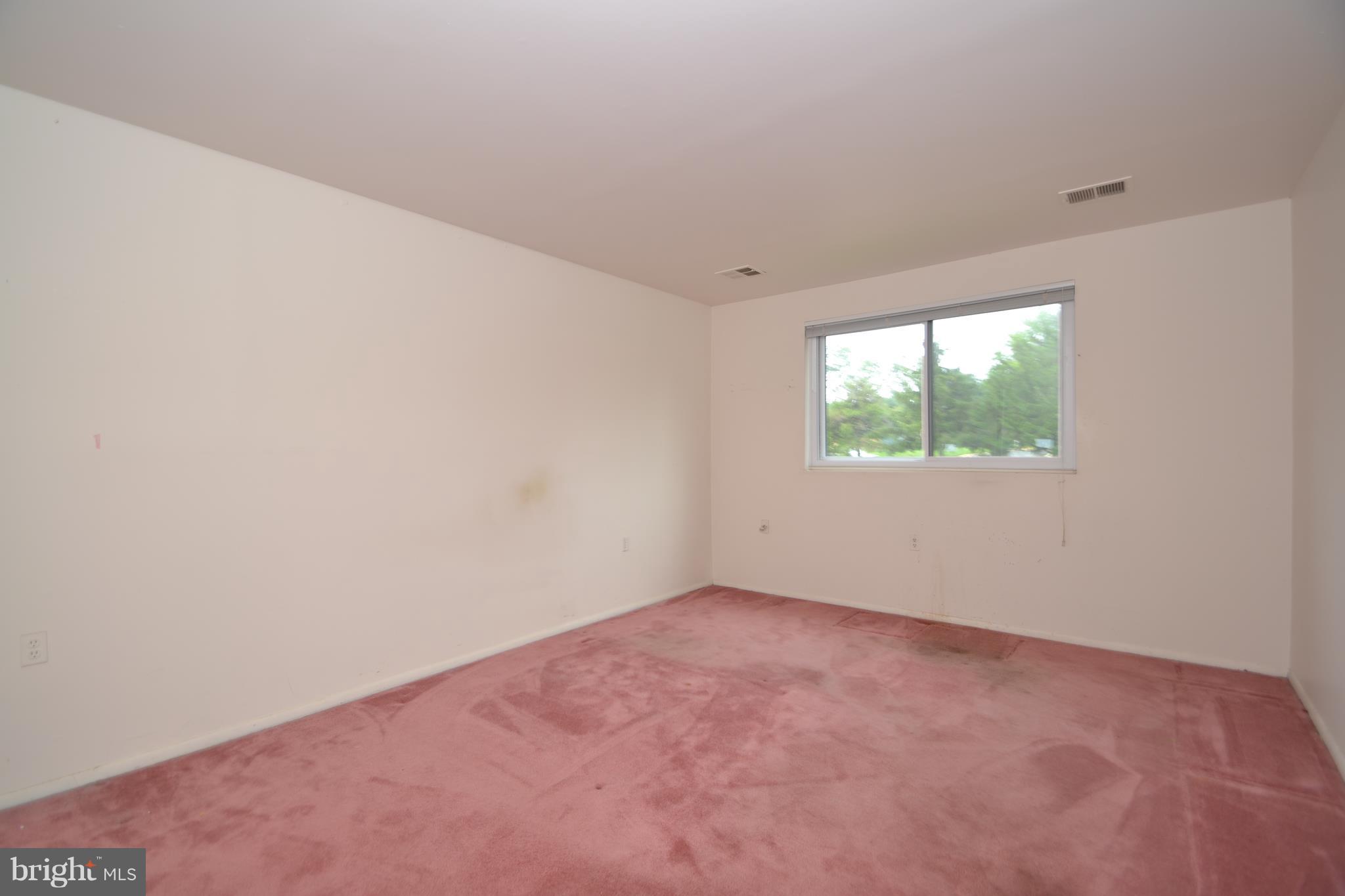 3922 Rolling Rd., Unit A5 Baltimore, MD 21208 - Photo 7 of 8 an empty room with windows