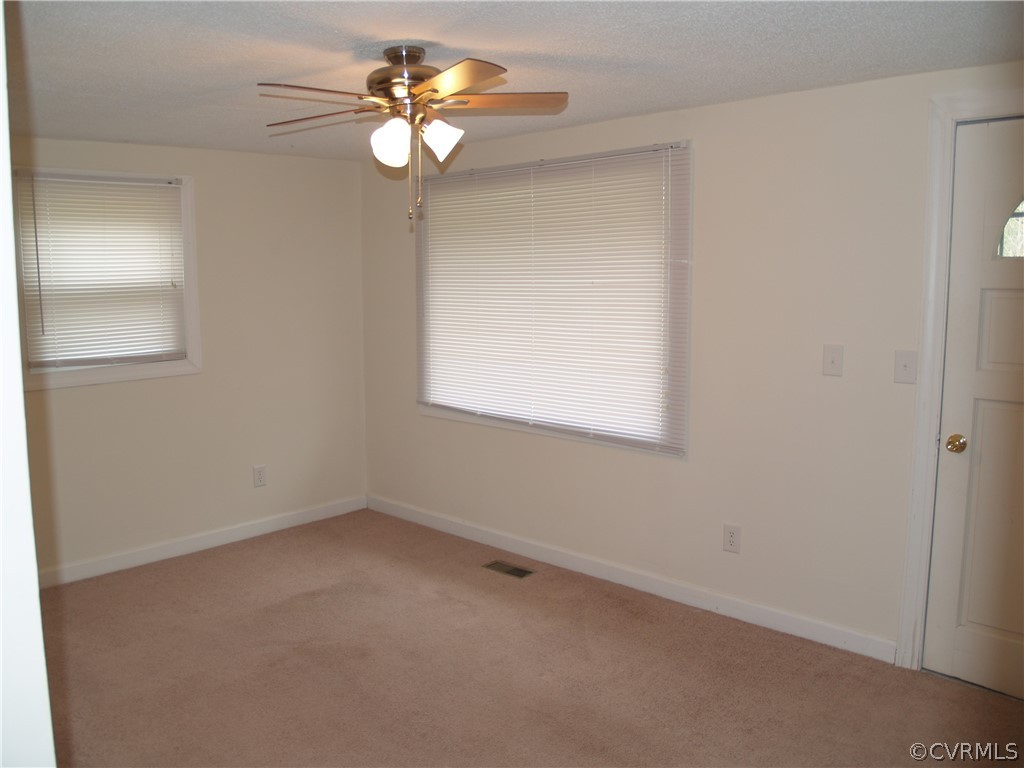 7700 Courthouse Road Providence Forge, VA 23140 - Photo 3 of 10 Carpet floor and ceiling fan in living room.