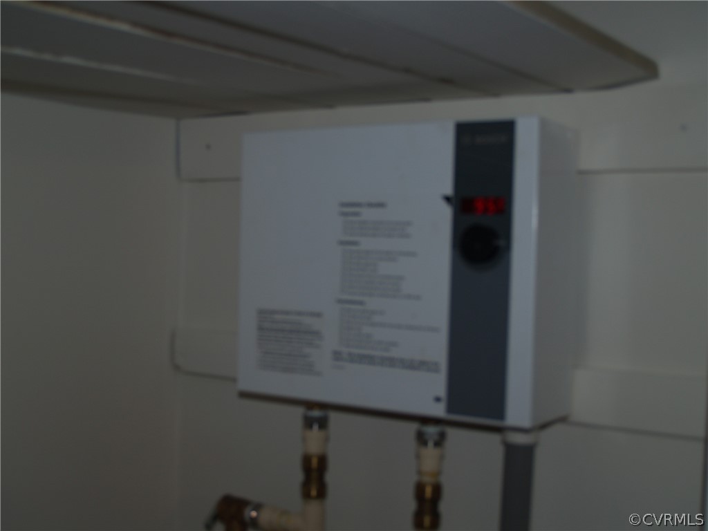 7700 Courthouse Road Providence Forge, VA 23140 - Photo 10 of 10 Tankless water heater in laundry closet.