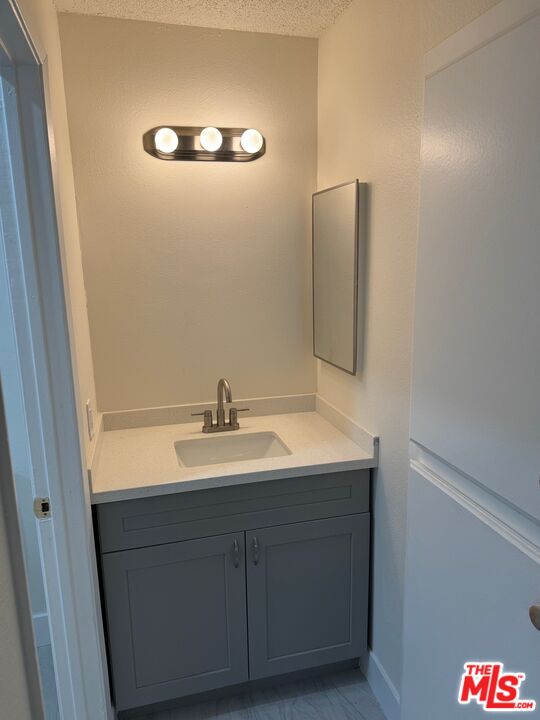 428 South Grand View Street Los Angeles, CA 90057 - Photo 14 of 29 a bathroom with a sink and a mirror