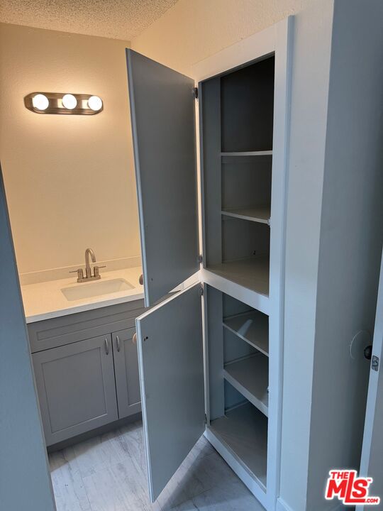 428 South Grand View Street Los Angeles, CA 90057 - Photo 15 of 29 a bathroom with a sink and mirror