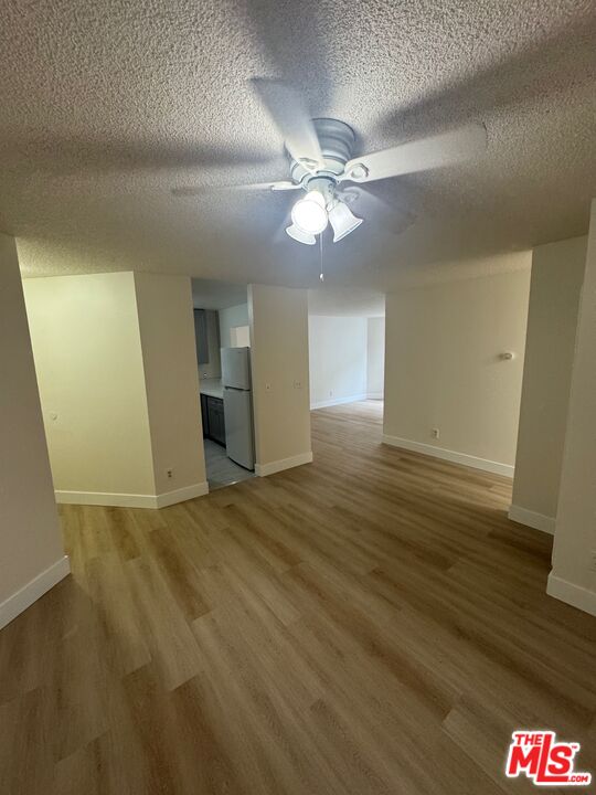 428 South Grand View Street Los Angeles, CA 90057 - Photo 5 of 29 wooden floor in an empty room with a window