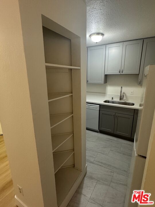 428 South Grand View Street Los Angeles, CA 90057 - Photo 6 of 29 a kitchen with stainless steel appliances a sink and cabinets
