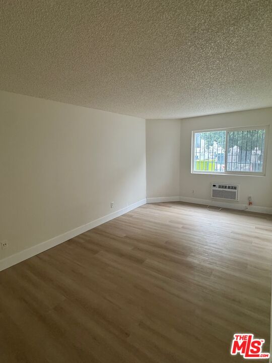 428 South Grand View Street Los Angeles, CA 90057 - Photo 9 of 29 an empty room with windows
