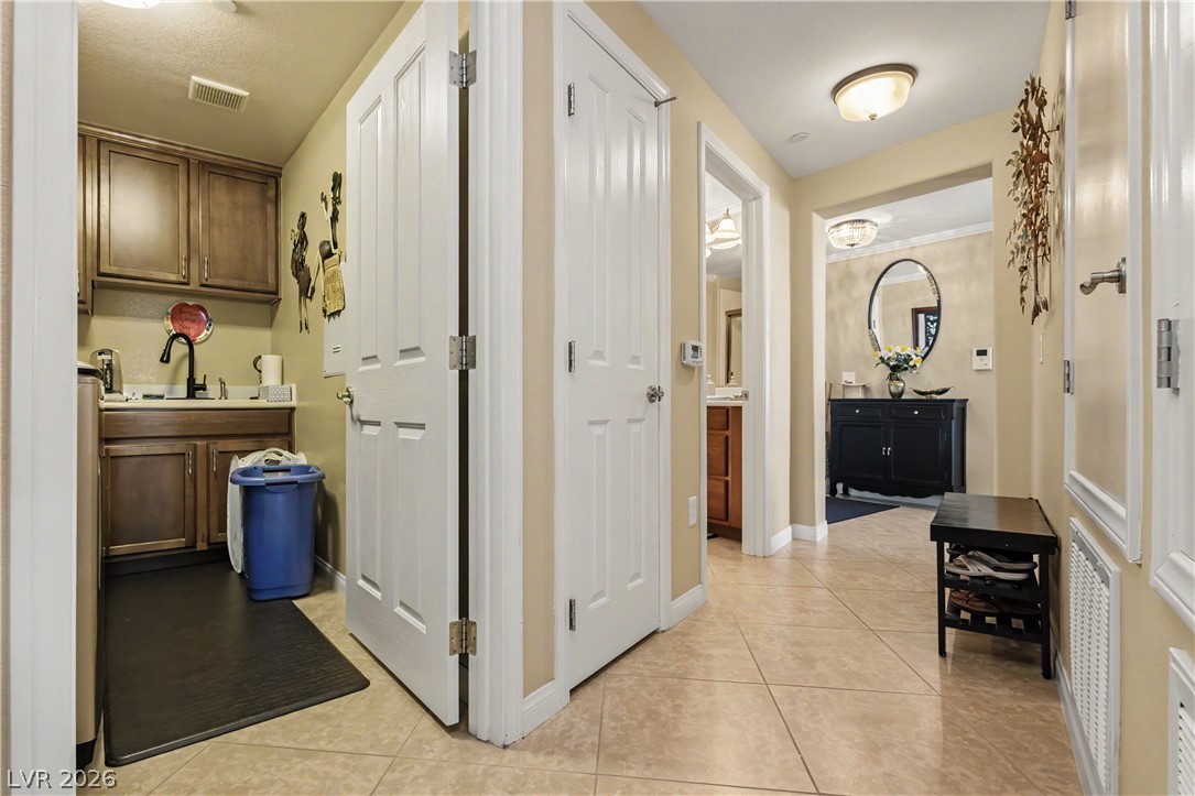 2555 Hampton Road, Unit 3308 Henderson, NV 89052 - Photo 30 of 65 An inviting entry foyer transitions seamlessly to a well-appointed laundry area, providing practical living.