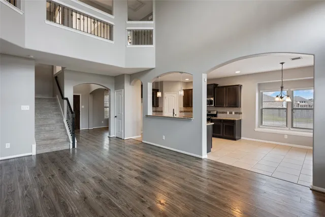 a view of a kitchen with a sink hardwood floor and a kitchen