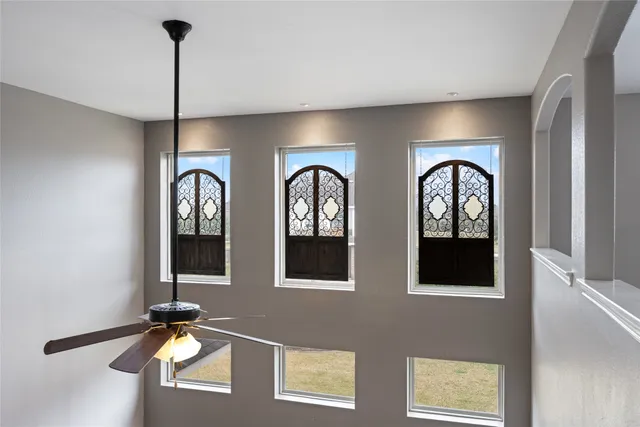 a couple of potted plants sitting next to a window