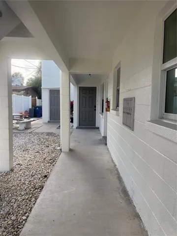 a view of a hall with an entryway