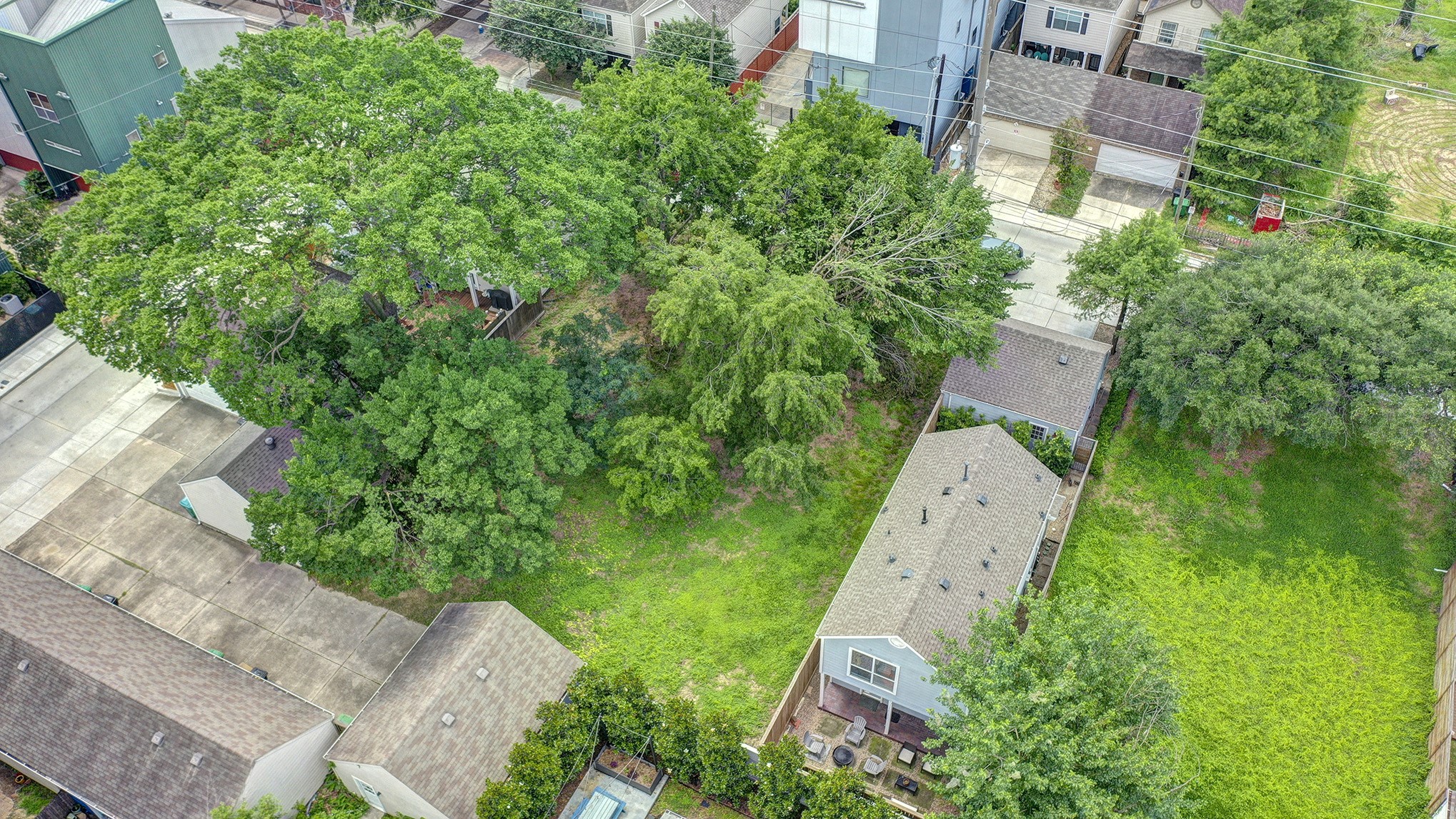 0 Ruthven Street Houston, TX 77019 - Photo 3 of 8 an aerial view of a house with a yard and garden