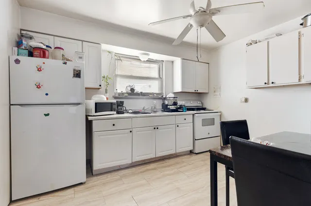 a kitchen with a refrigerator a sink and dishwasher