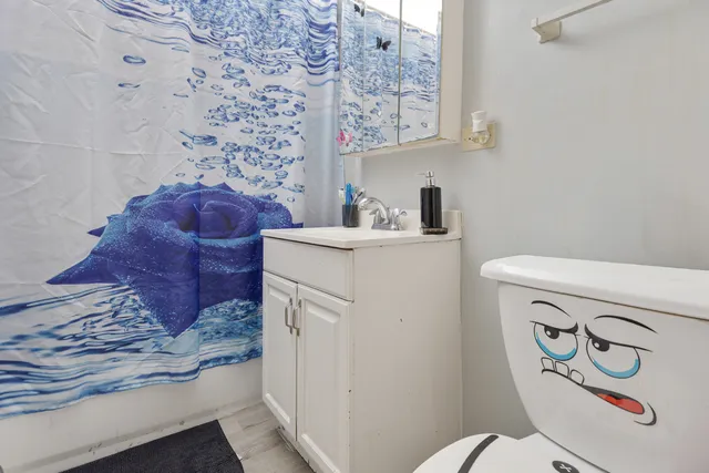 a bathroom with a toilet and a sink