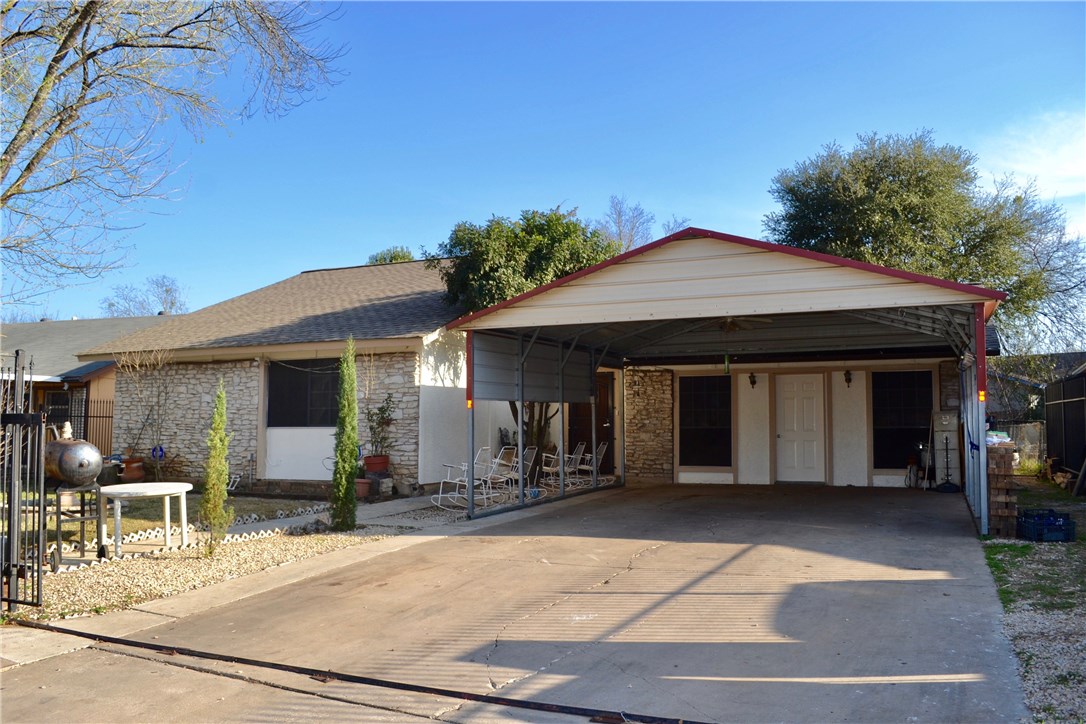 6607 Ripple Run Austin, TX 78744 - Photo 1 of 1 a front view of a house with garden