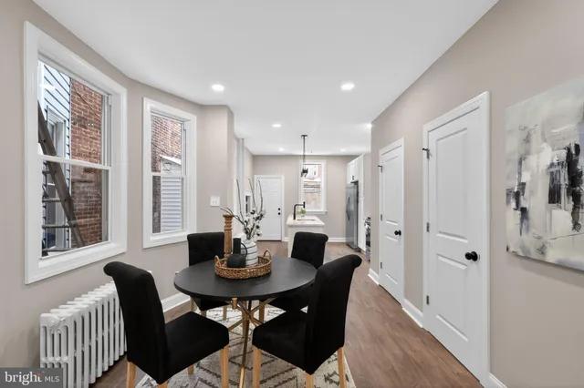 a view of a dining room with furniture and window