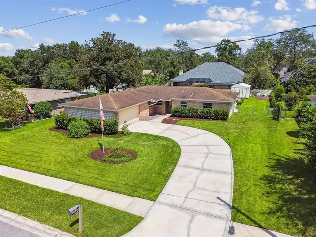 a view of a garden with a building in the background