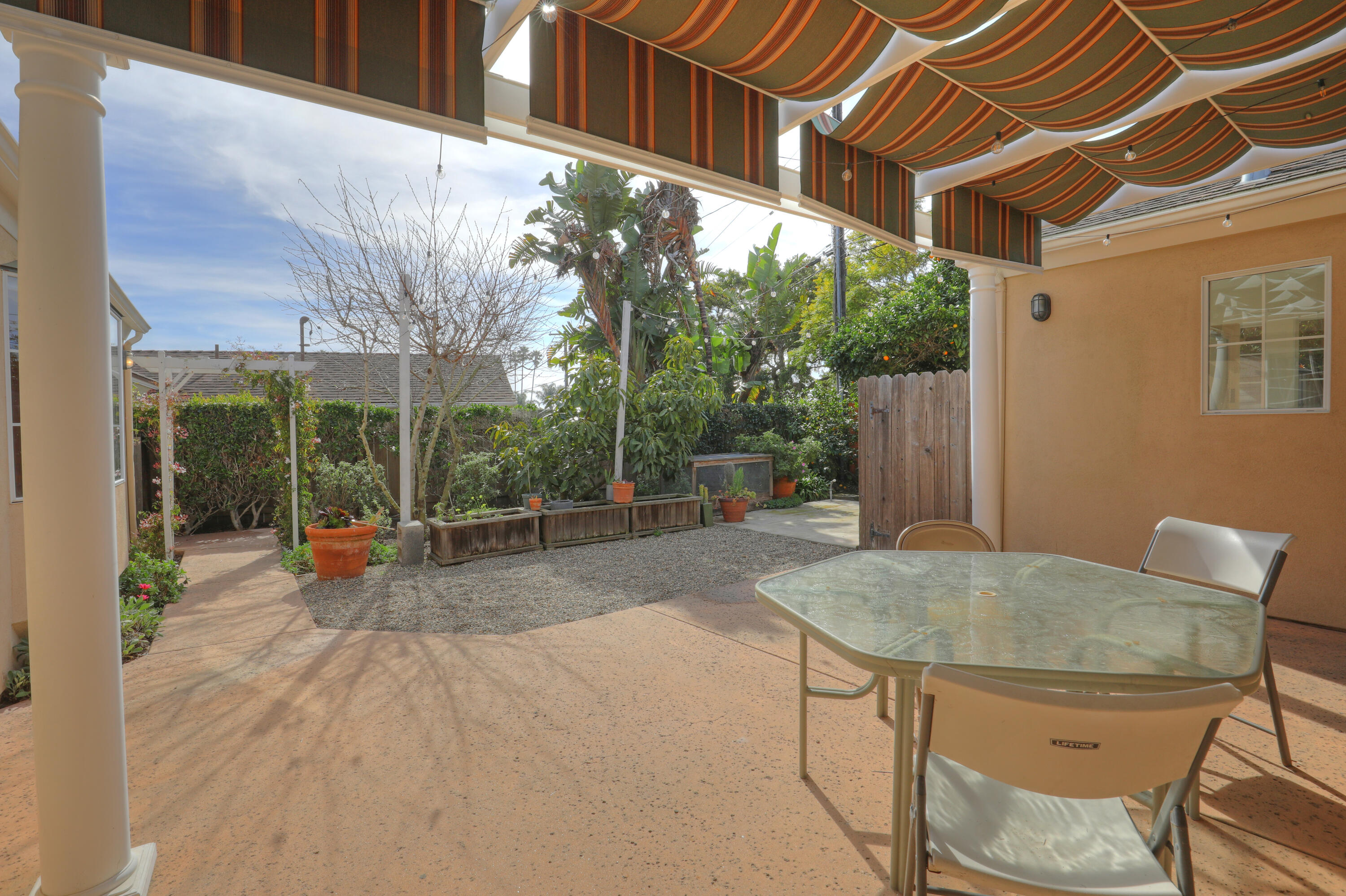 129 San Clemente Santa Barbara, CA 93109 - Photo 19 of 23 a backyard of a house with table and chairs